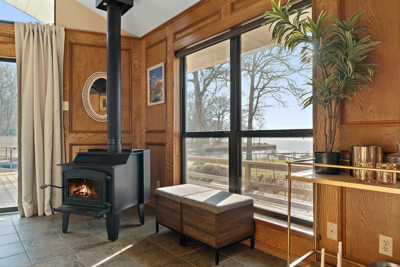 Wood stove and original wood paneling at Duck Cove